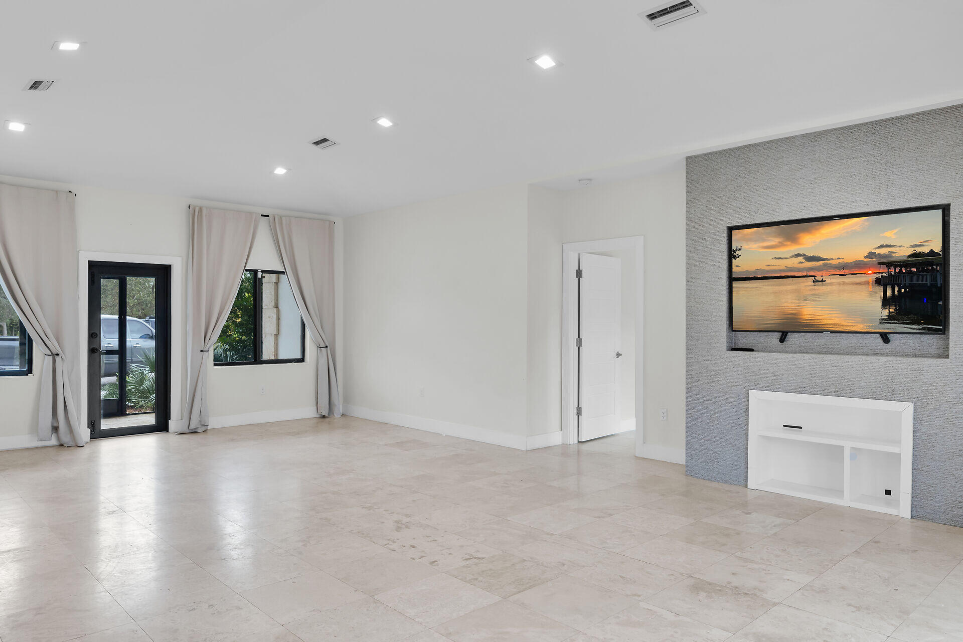 19900 Southwest 280th Street Homestead, FL 33031 - Photo 21 of 52 a view of a livingroom with an empty space and a window