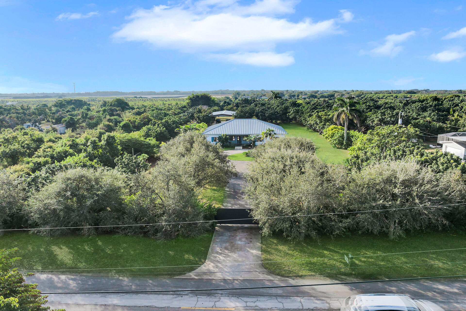 19900 Southwest 280th Street Homestead, FL 33031 - Photo 3 of 52 an aerial view of a residential houses with outdoor space and trees