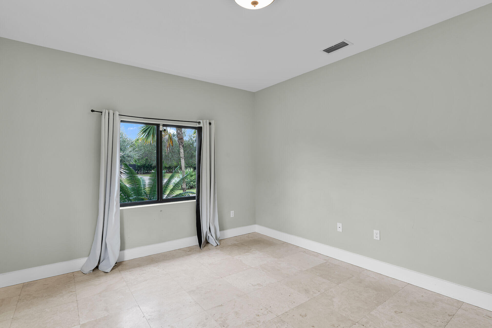 19900 Southwest 280th Street Homestead, FL 33031 - Photo 33 of 52 an empty room with wooden floor and window