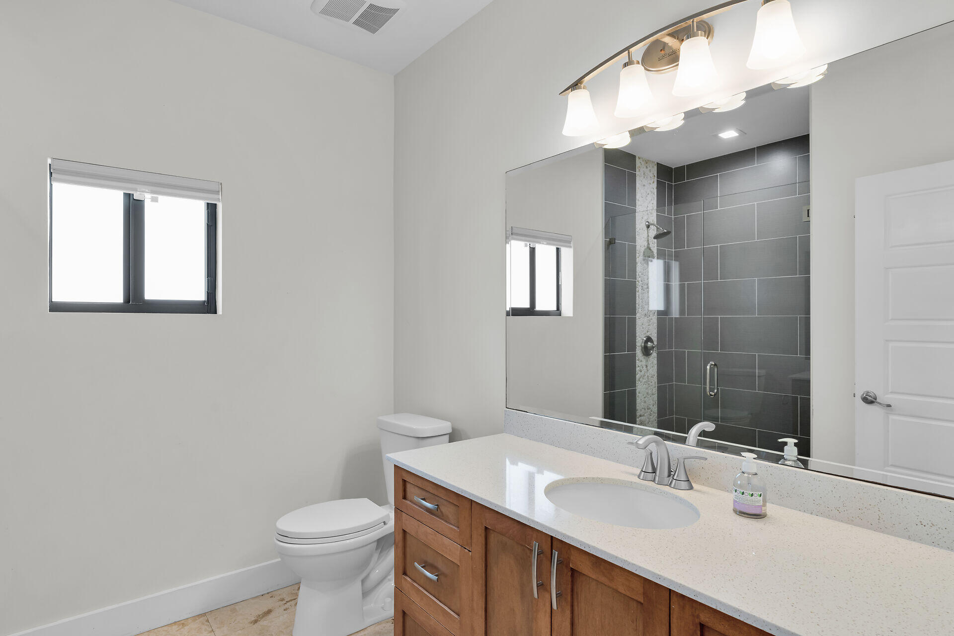 19900 Southwest 280th Street Homestead, FL 33031 - Photo 35 of 52 a bathroom with a sink a toilet and shower