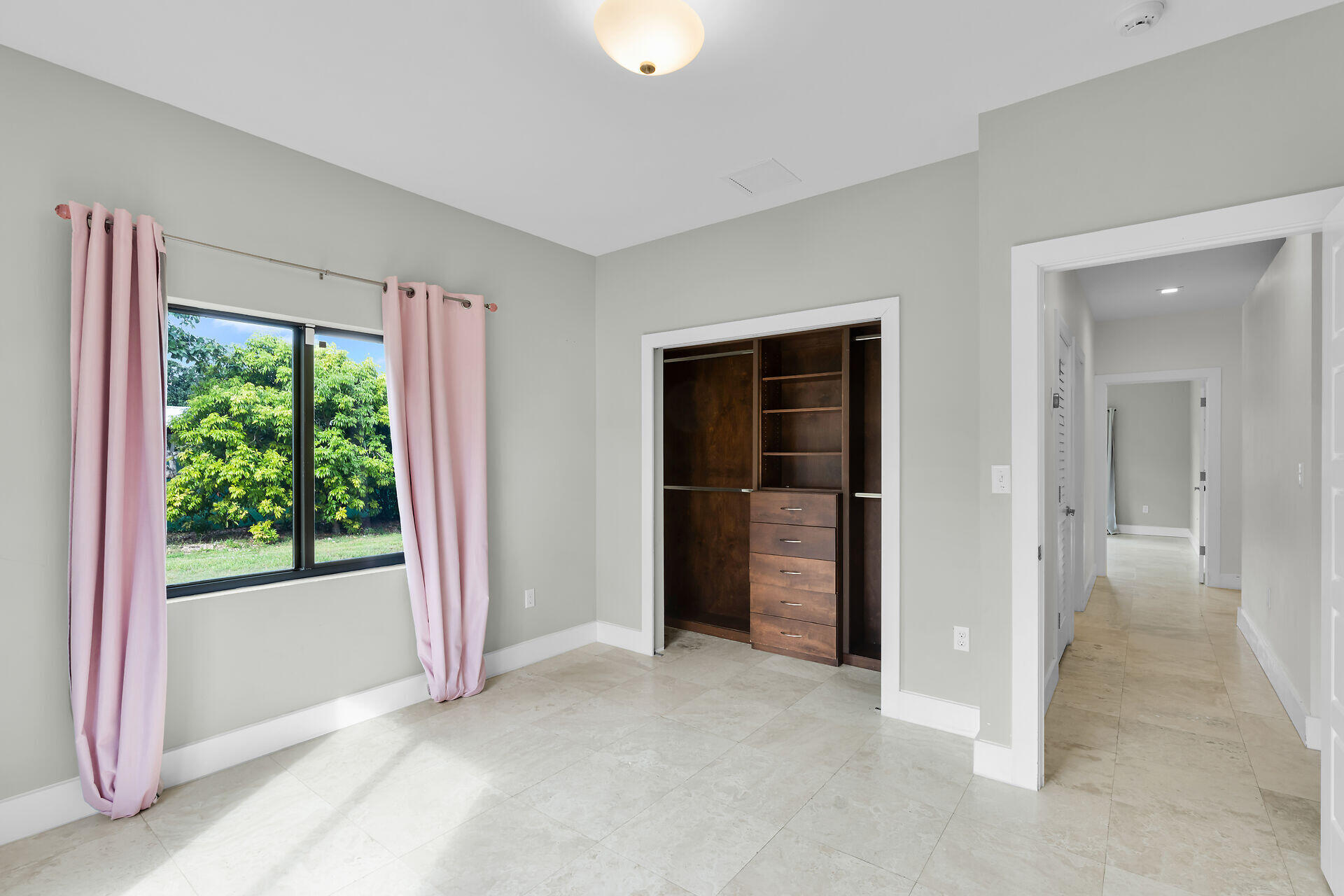 19900 Southwest 280th Street Homestead, FL 33031 - Photo 38 of 52 an empty room with windows and closet