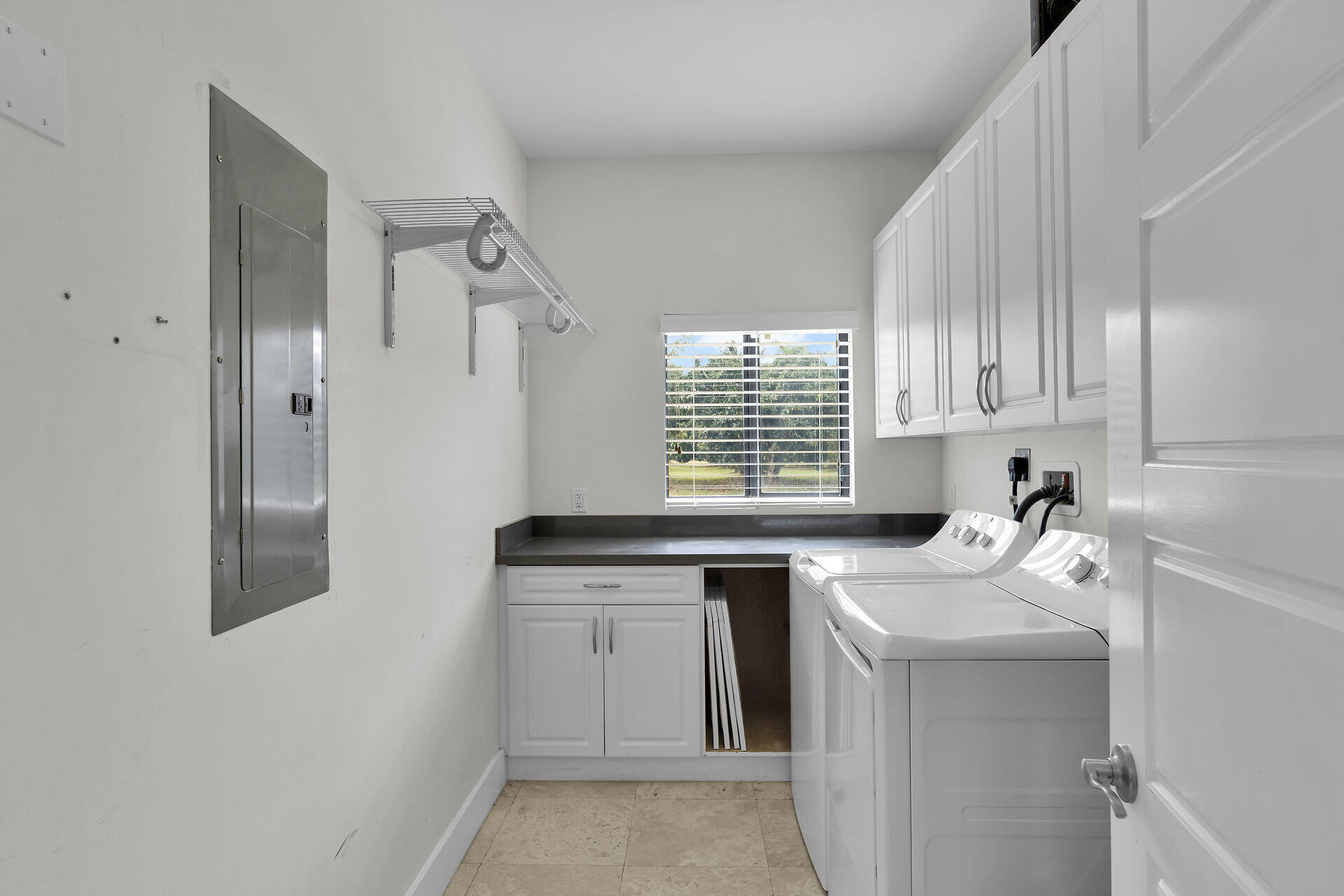 19900 Southwest 280th Street Homestead, FL 33031 - Photo 39 of 52 a kitchen with a sink stove and cabinets