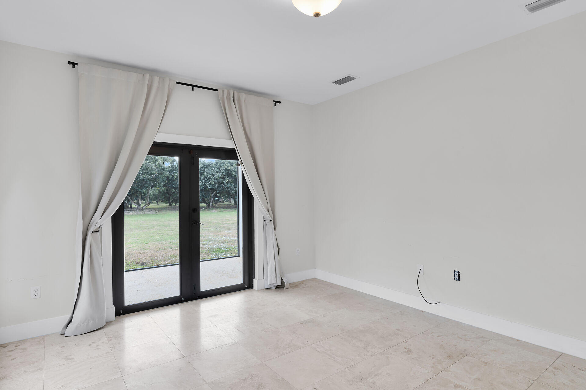 19900 Southwest 280th Street Homestead, FL 33031 - Photo 42 of 52 an empty room with large window