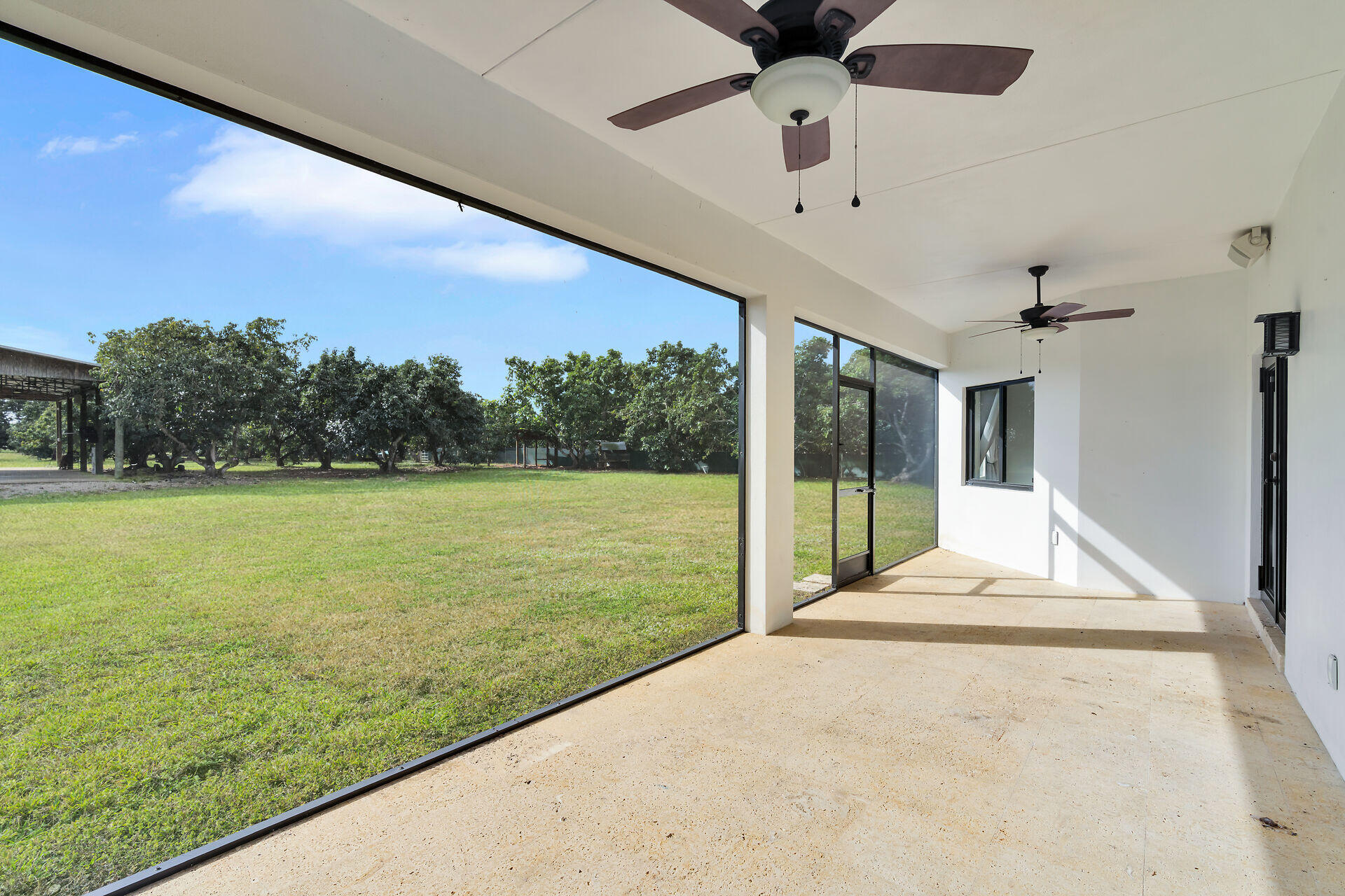 19900 Southwest 280th Street Homestead, FL 33031 - Photo 50 of 52 a view of a patio with a yard