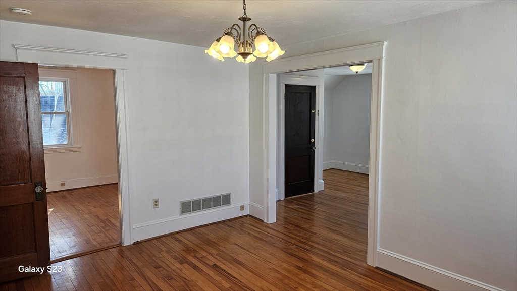 17 Cleveland Avenue, Unit 3 Worcester, MA 01603 - Photo 11 of 25 wooden floor in an empty room with a window