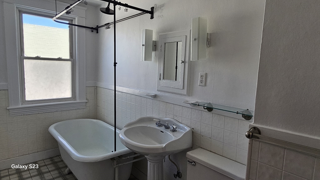 17 Cleveland Avenue, Unit 3 Worcester, MA 01603 - Photo 18 of 25 a bathroom with a toilet a sink and mirror