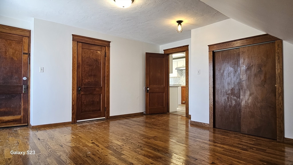 17 Cleveland Avenue, Unit 3 Worcester, MA 01603 - Photo 21 of 25 an empty room with wooden floor and closet