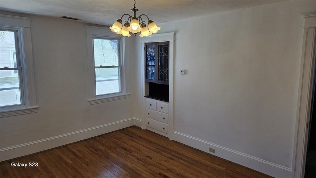17 Cleveland Avenue, Unit 3 Worcester, MA 01603 - Photo 7 of 25 a view of a room with wooden floor and chandelier