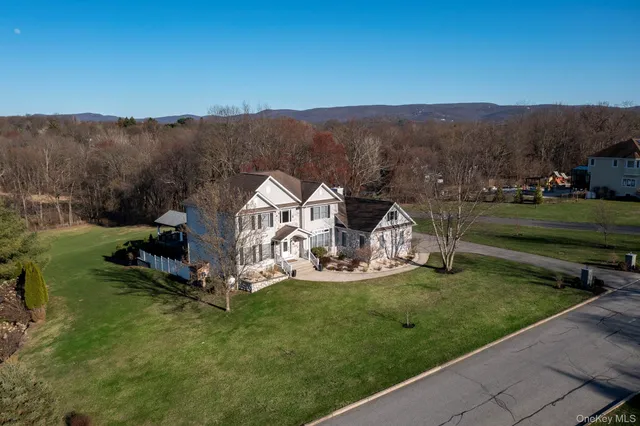 a view of a garden with a house