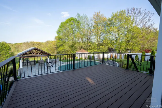 a view of a balcony with wooden floor