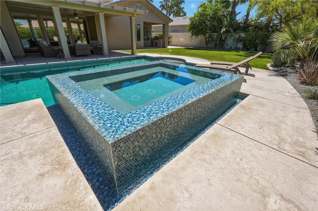 9 Orleans Road Rancho Mirage, CA 92270 - Photo 58 of 71 swimming pool with outdoor seating