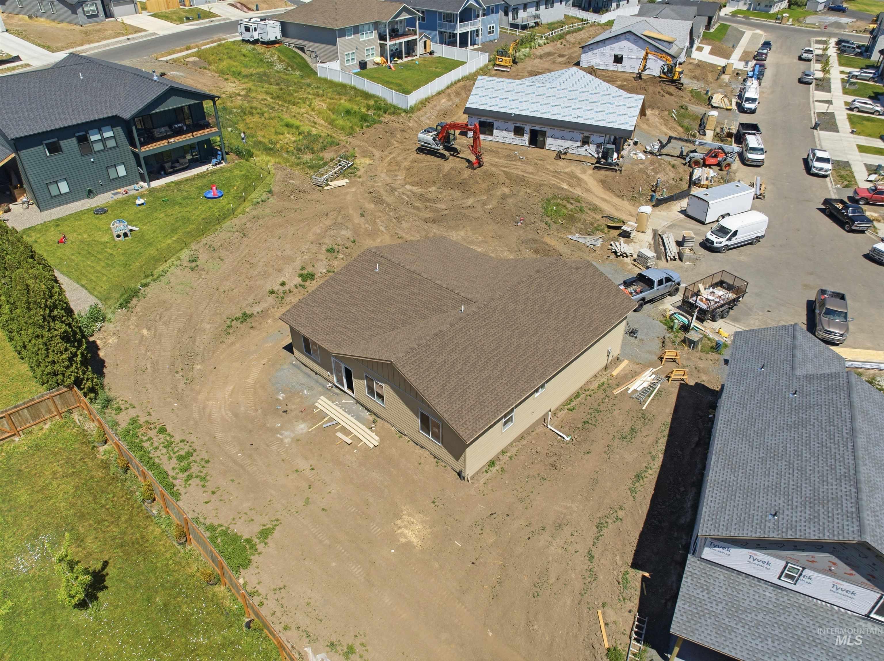 2812 Cyprus Court Moscow, ID 83843 - Photo 18 of 22 Sprawling residential landscape featuring established homes, mature trees, developing properties, paved roads, and distant hills