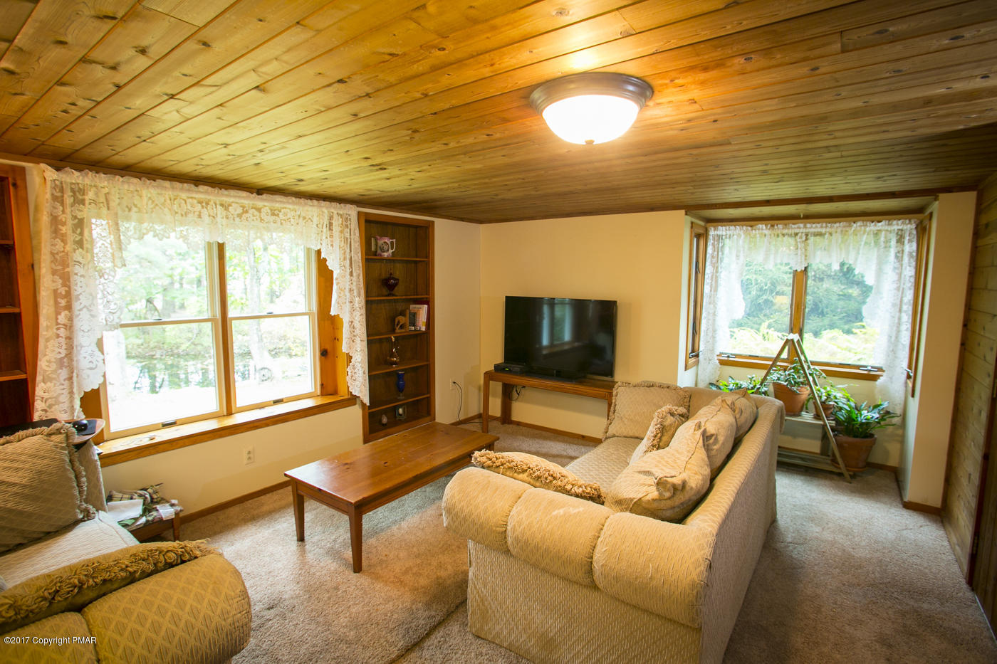 429 Upper Swiftwater Road Cresco, PA 18326 - Photo 17 of 50 a living room with furniture and a flat screen tv