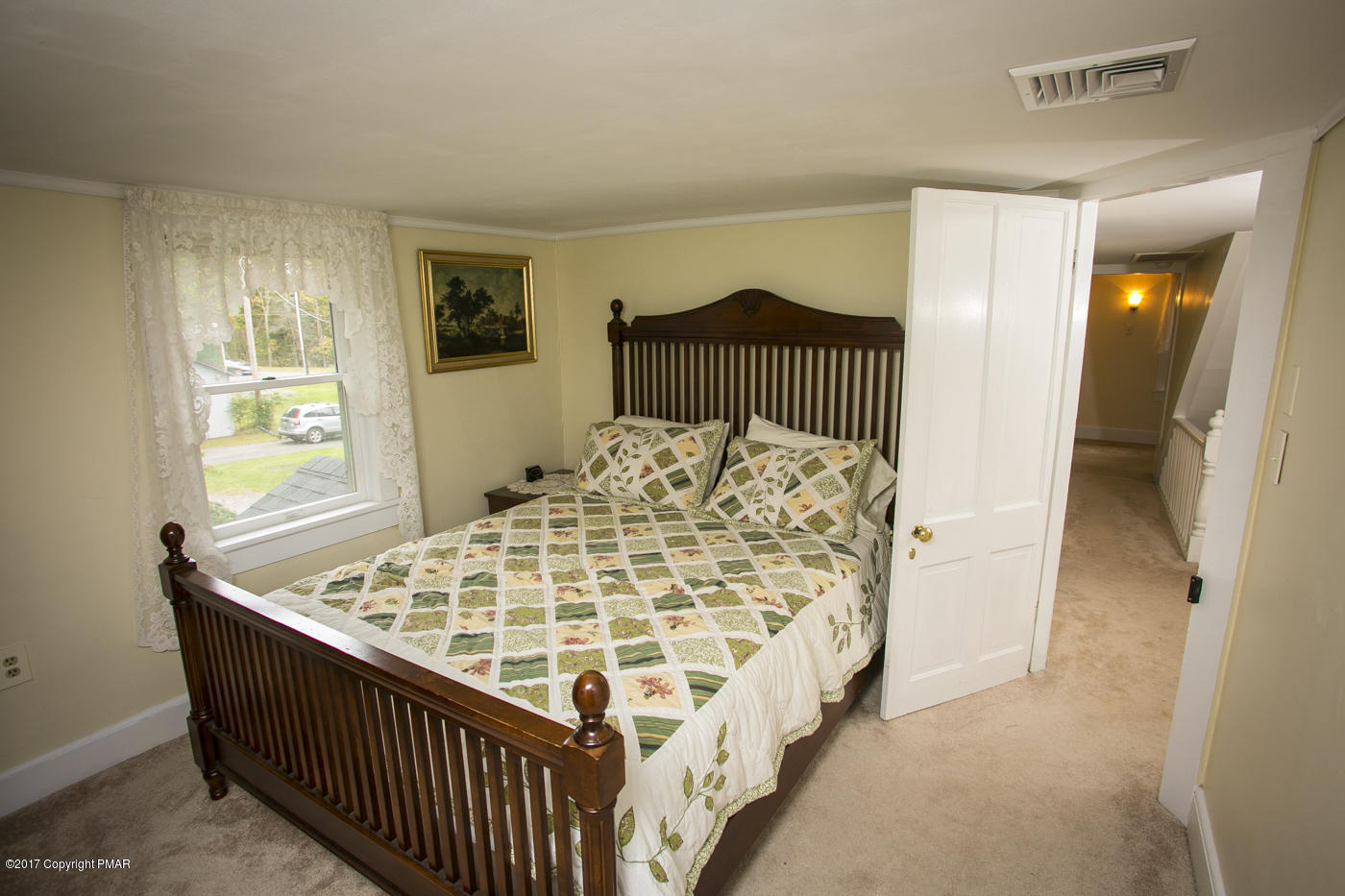 429 Upper Swiftwater Road Cresco, PA 18326 - Photo 29 of 50 a bedroom with a bed and a window