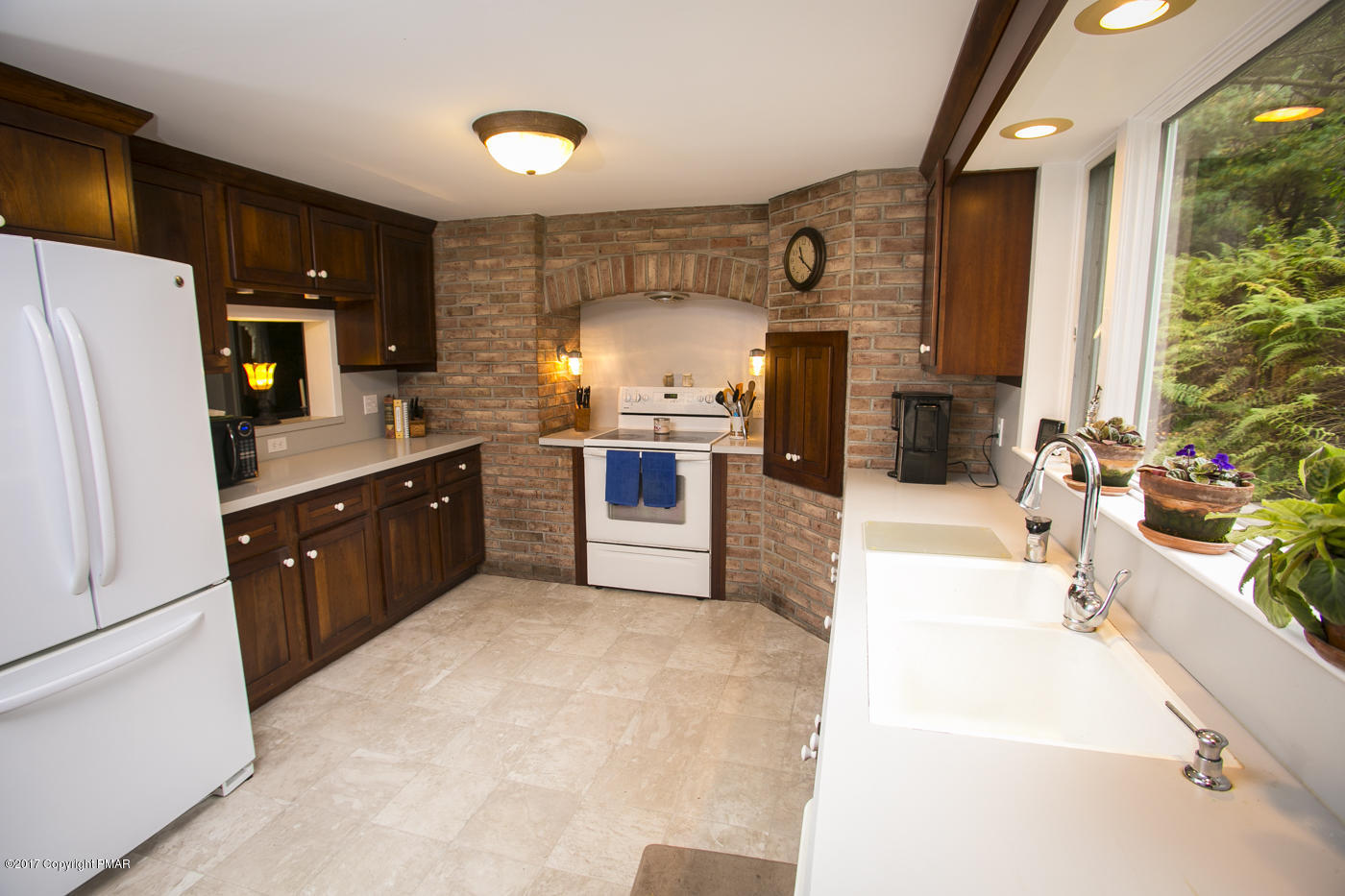429 Upper Swiftwater Road Cresco, PA 18326 - Photo 7 of 50 a large kitchen with stainless steel appliances granite countertop a stove a sink dishwasher and a refrigerator
