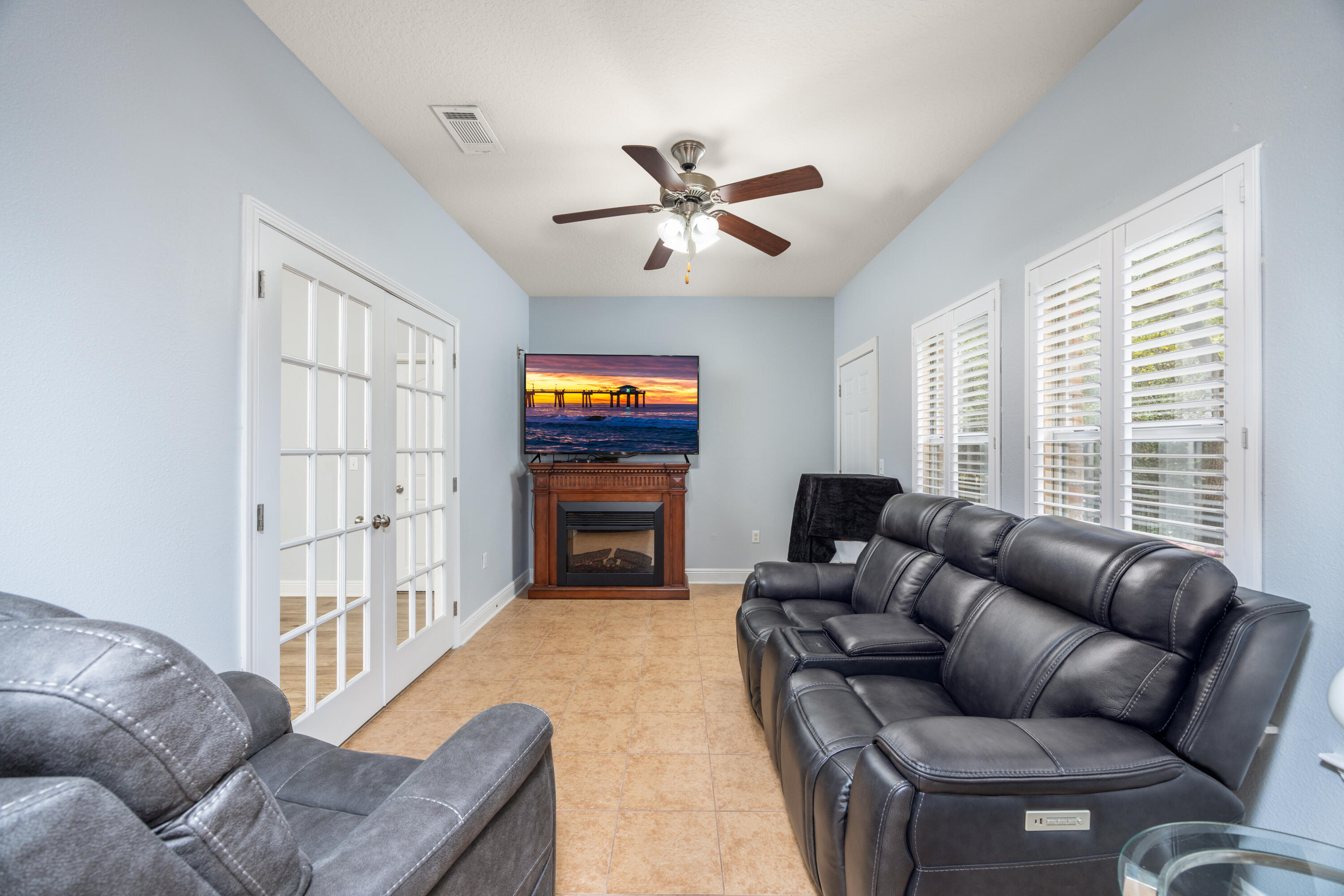 38 Camellia Court Freeport, FL 32439 - Photo 15 of 91 a living room with furniture a ceiling fan and a window
