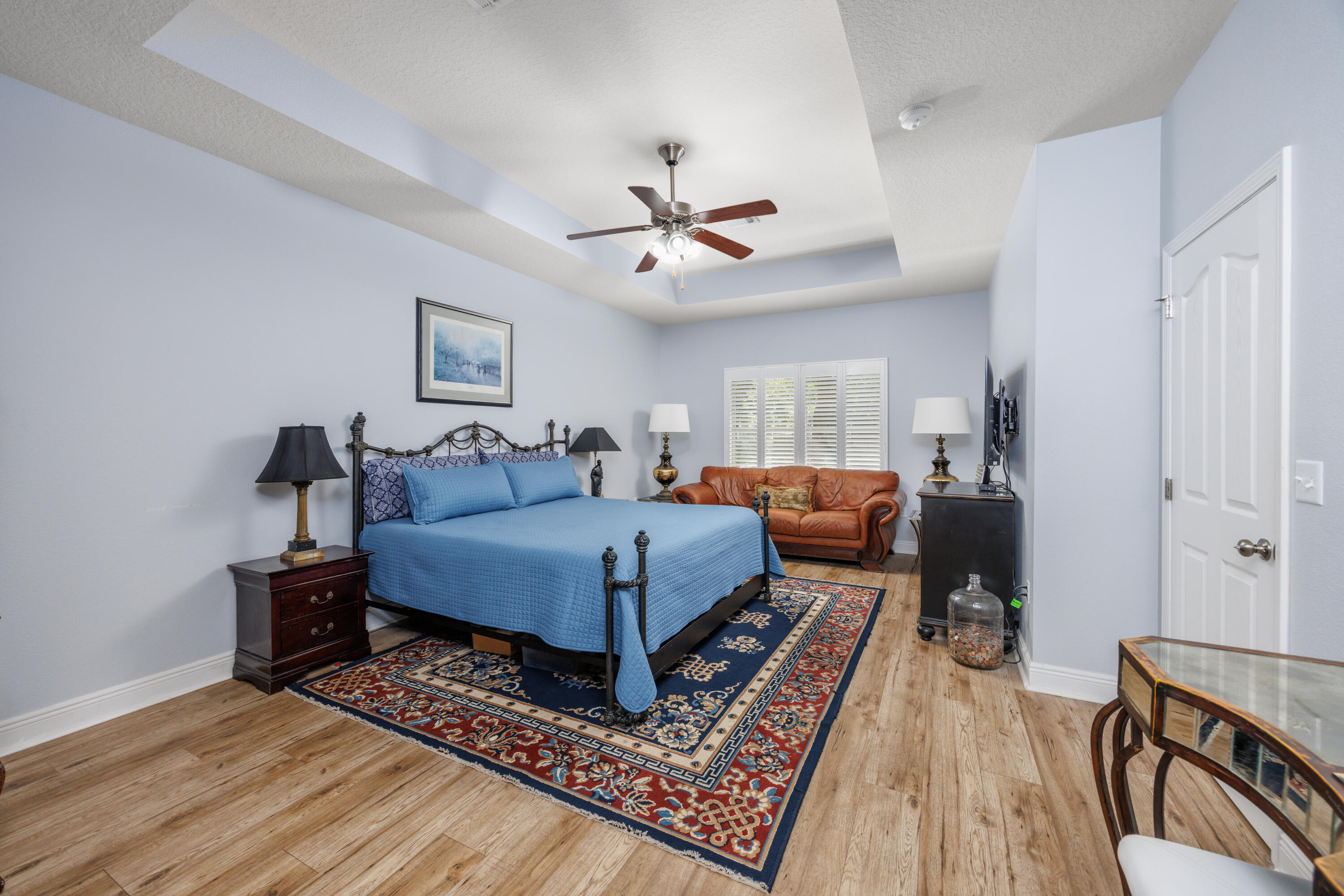 38 Camellia Court Freeport, FL 32439 - Photo 17 of 91 a bed room with a bed and a chandelier