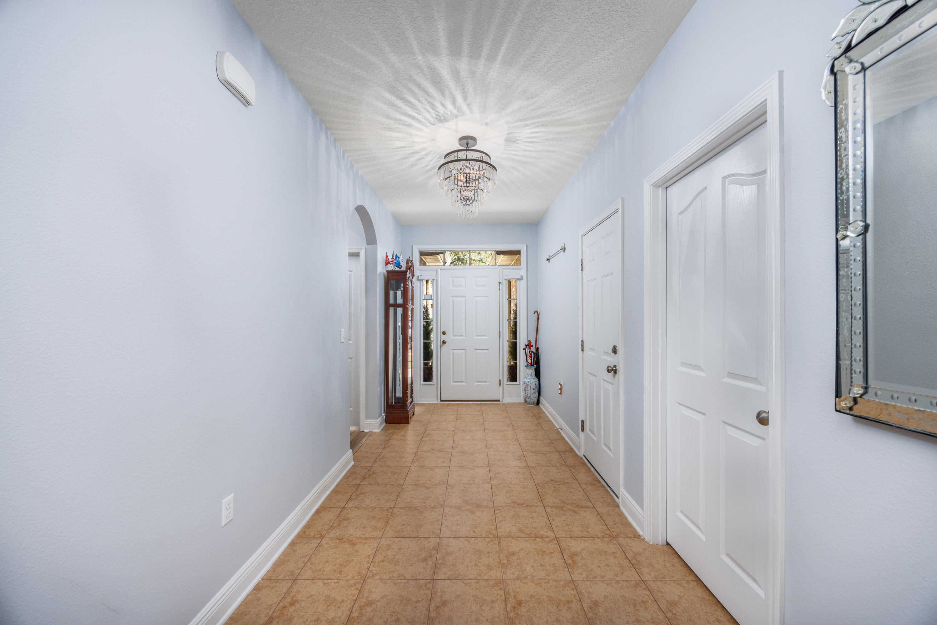 38 Camellia Court Freeport, FL 32439 - Photo 5 of 91 a view of a hallway with wooden floor
