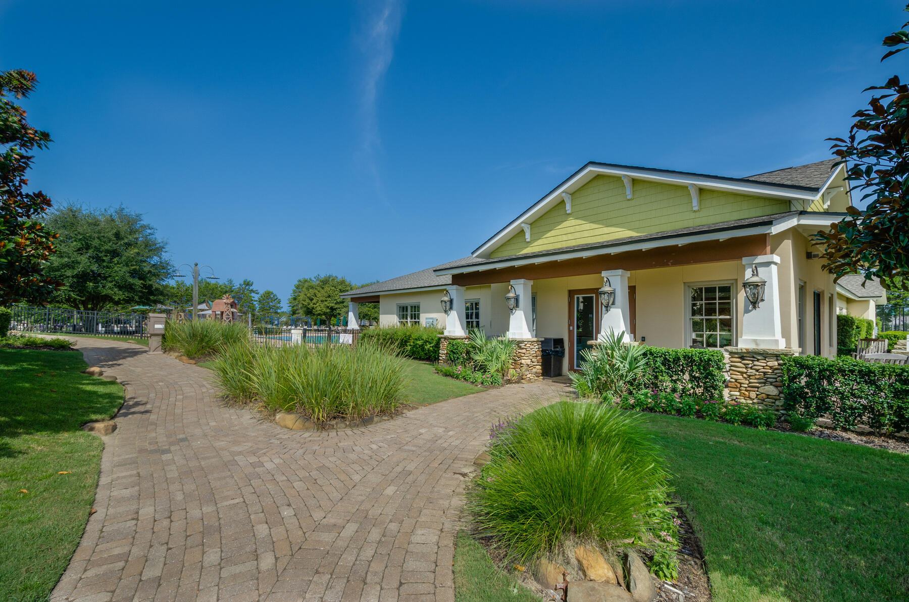 38 Camellia Court Freeport, FL 32439 - Photo 60 of 91 a front view of a house with a yard and potted plants