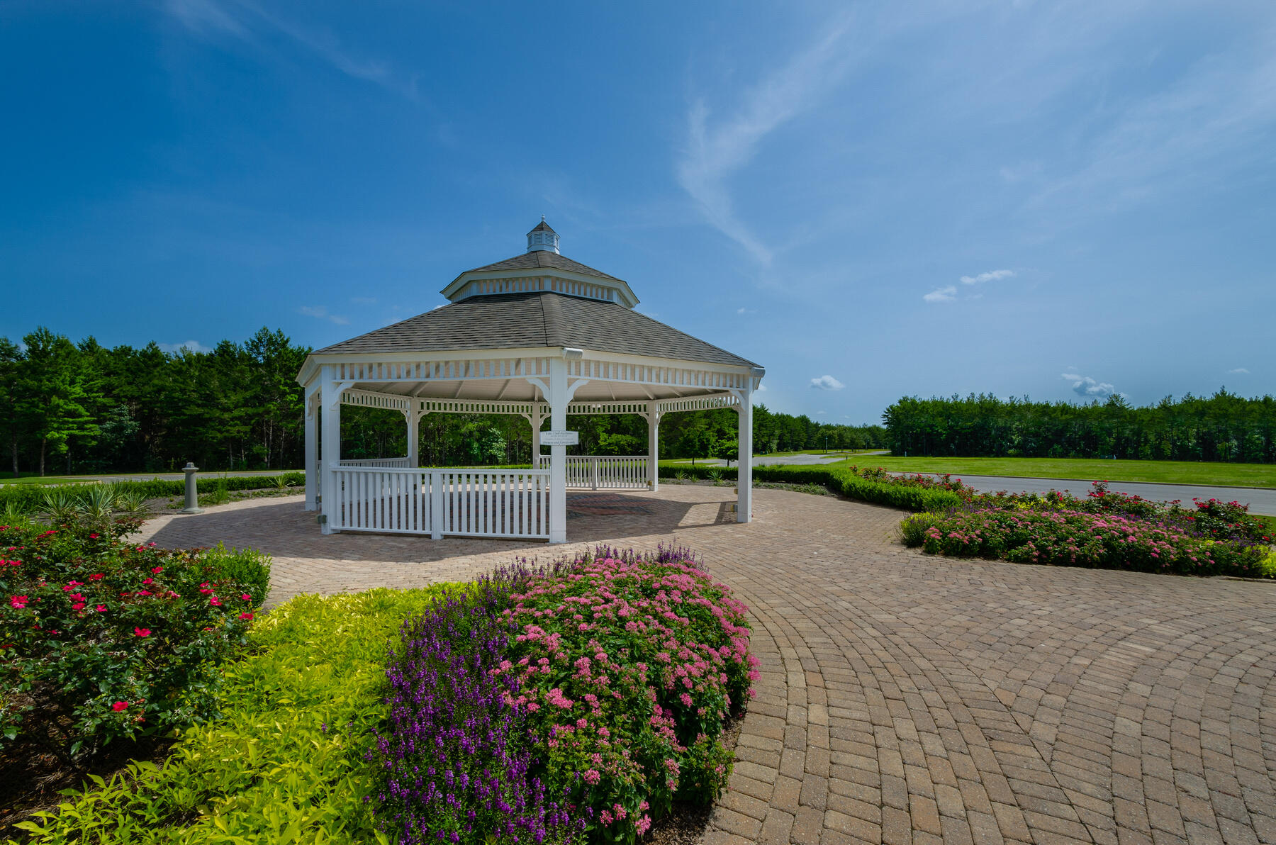 38 Camellia Court Freeport, FL 32439 - Photo 77 of 91 a view of a garden with a bench in a garden