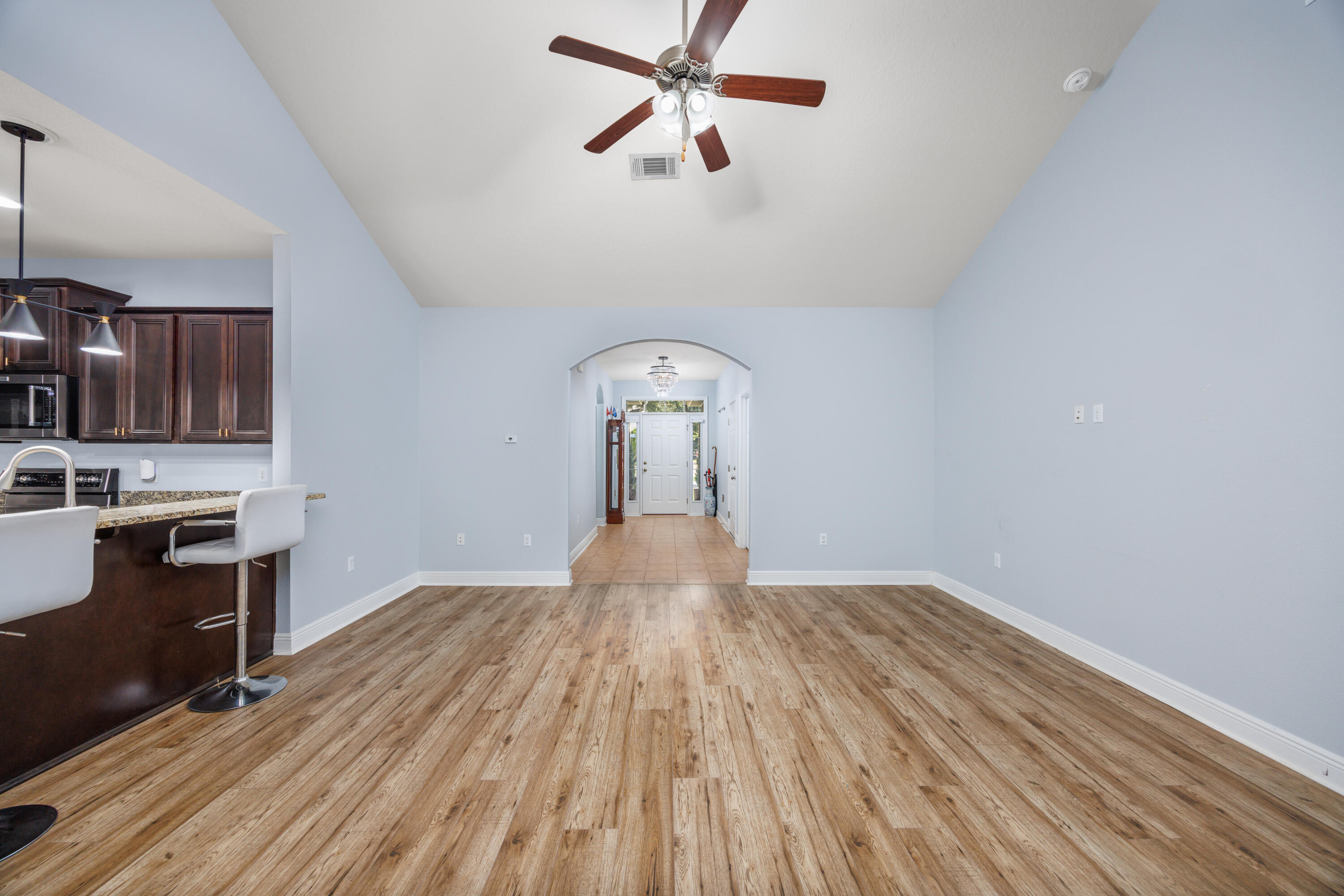 38 Camellia Court Freeport, FL 32439 - Photo 9 of 91 a view of a kitchen with wooden floor a sink and dishwasher a refrigerator with wooden floor