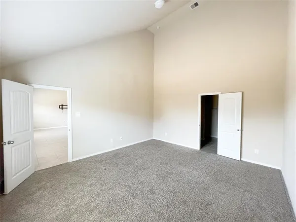 a bathroom with a double vanity sink a mirror and a shower