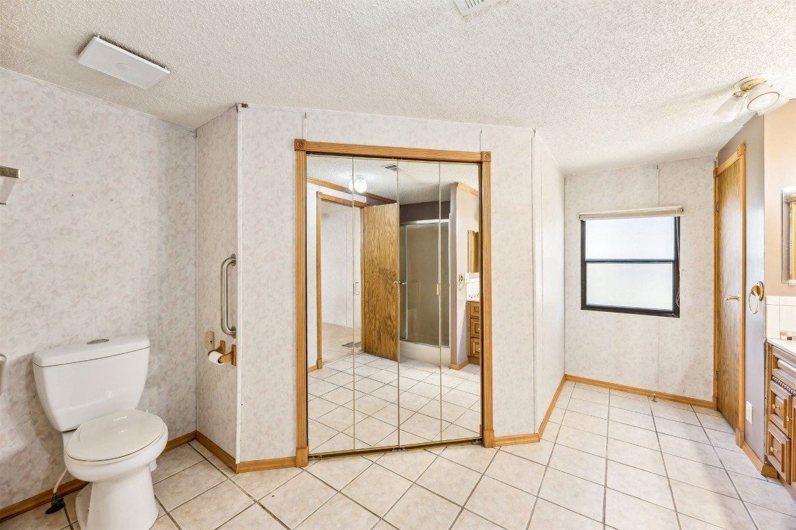 85256 Stephen Road Yulee, FL 32097 - Photo 17 of 40 a bathroom with a toilet and a shower