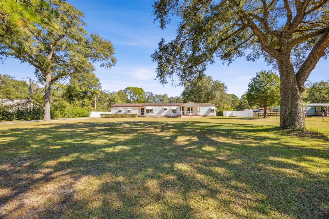 85256 Stephen Road Yulee, FL 32097 - Photo 2 of 40 a view of green field with trees