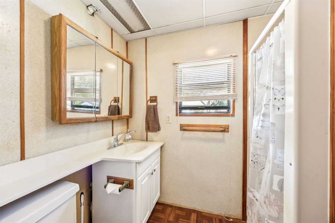 85256 Stephen Road Yulee, FL 32097 - Photo 25 of 40 a bathroom with a sink a mirror and a shower