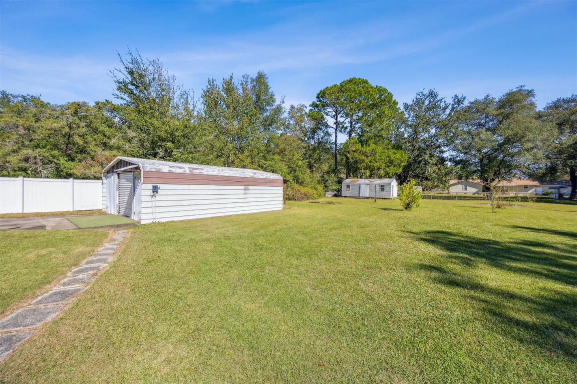 85256 Stephen Road Yulee, FL 32097 - Photo 30 of 40 a view of a big yard with large trees