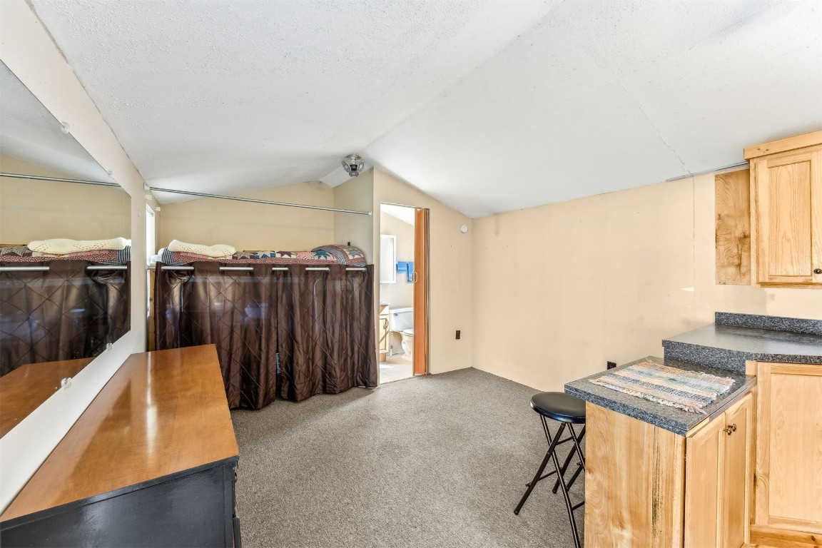 85256 Stephen Road Yulee, FL 32097 - Photo 34 of 40 a bedroom with a bed and a table in it