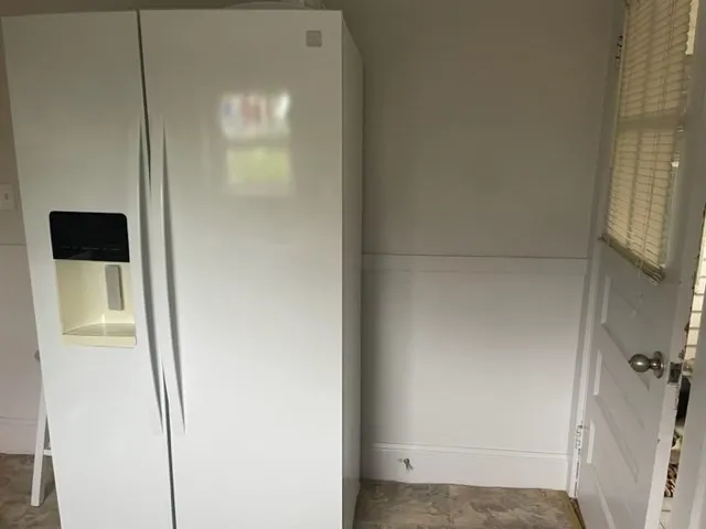 a bedroom with a bed and lamp