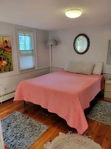 a view of a backyard with plants and a garden