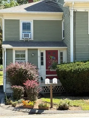 a front view of house and yard with green space