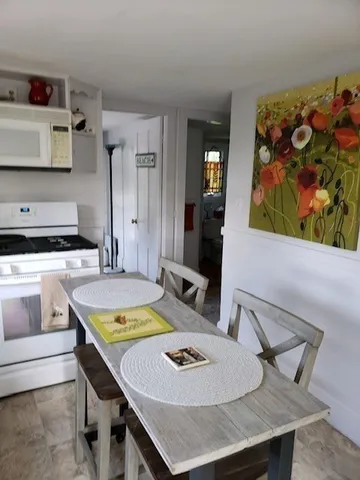a view of a dining room with furniture