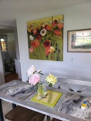 a view of a dining table and chairs in a room