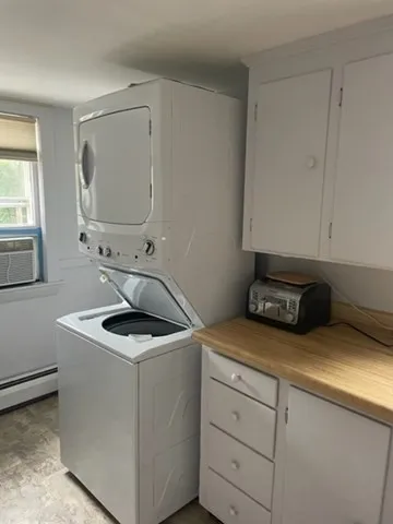 a kitchen with a sink cabinets and window