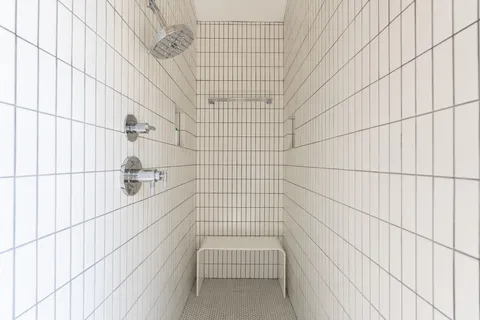 a bedroom with a large bed and a large window