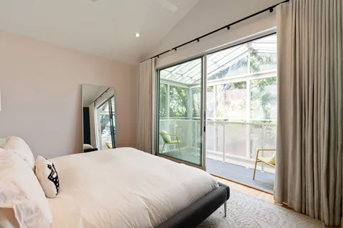 a view of hallway with wooden floor