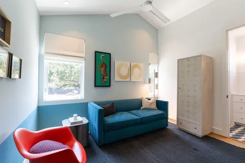 a bathroom with a double vanity sink a mirror and a shower