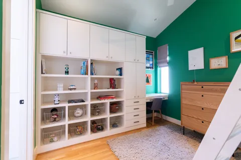 a dining room with a table and chairs