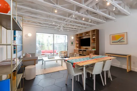 a dining room with a table and chairs