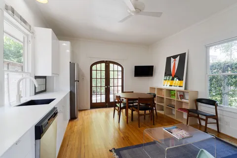 a kitchen with stainless steel appliances granite countertop a stove a refrigerator and a microwave