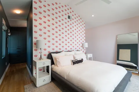 a bedroom with a bed and a view of bathroom