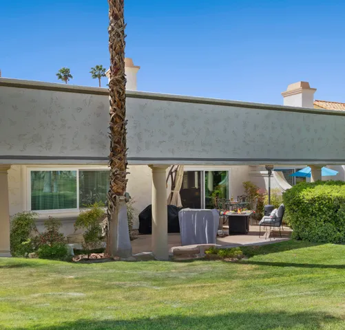 a view of house with swimming pool yard fire pit and outdoor seating