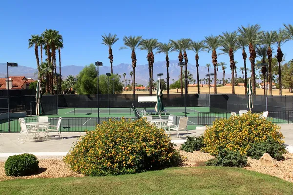 a room with gym equipment and windows