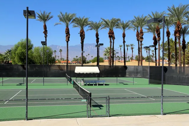 a view of a swimming pool with patio