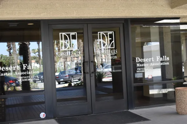 a room with gym equipment and windows