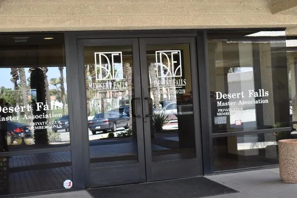 a view of a swimming pool with a table and chairs