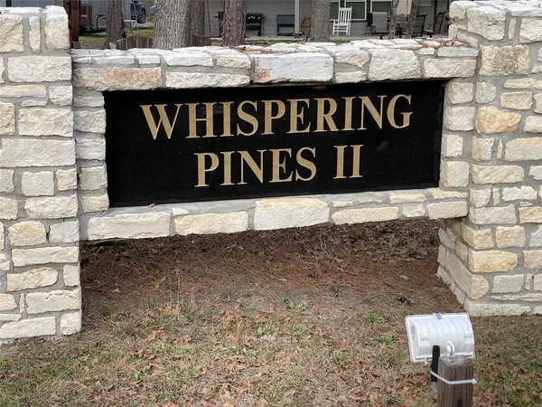 a street sign on a brick wall